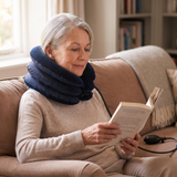 Older woman reading with the neck traction device